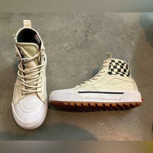 Vans high-top checkered sneakers.